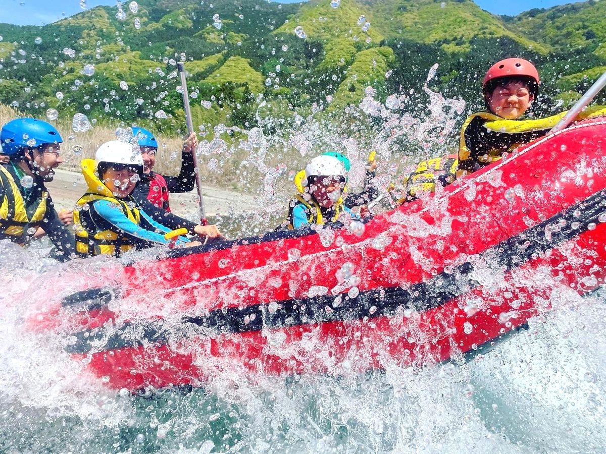 Gunma rafting with families splashing through mountain river water